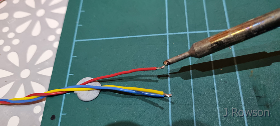 Monitoring Diesel (the Hamster)'s Movements - Soldering the motion sensor plugs (credit: James Rowson).