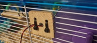 Monitoring Diesel (the Hamster)'s Movements - Wheel spin sensor cable tie'd onto the cage