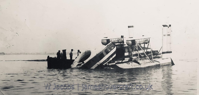 The end of the first era- Sad end for the VA3 first passenger service - Sad end for the VA3 first passenger service. Hovercraft sank off Ryde sands shortly after the merger of Saunders Roe and Vickers to make BHC. Explosives weren't enough so sinking with axes and manpower eventually got the craft submerged. Some curtains were rescued (Hovercraft Museum c/o Stuart Syrad MC) and steering wheel (with pilot Ray Old’s son) at the time of sinking. A few dials were later saved (Isle of Wight Dive Museum) by divers from the upturned hull on seabed 70ft under where she remains today. VA-3 had a spare giant lift fan given by Duxford Aircraft museum and now on show at the Hovercraft Museum (credit: Warwick Jacobs (2024)).